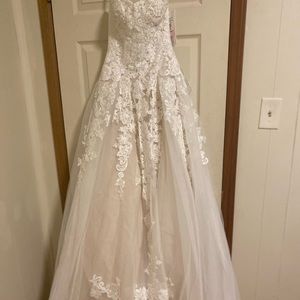 White cream wedding dress with beautiful design